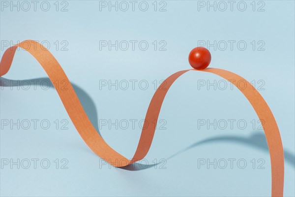 Orange ribbon with ball