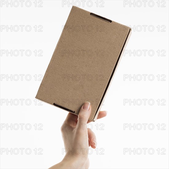 Hand holding cardboard box