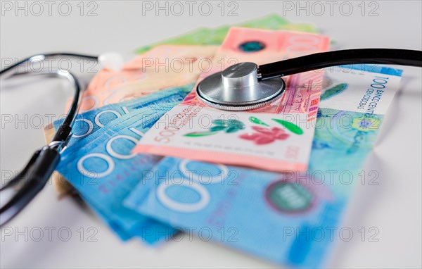 Stethoscope on Nicaraguan banknote isolated. Nicaraguan healthcare cost concept. Stethoscope on Nicaraguan banknotes on white background