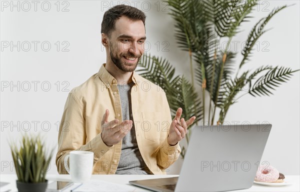 Man having video call laptop