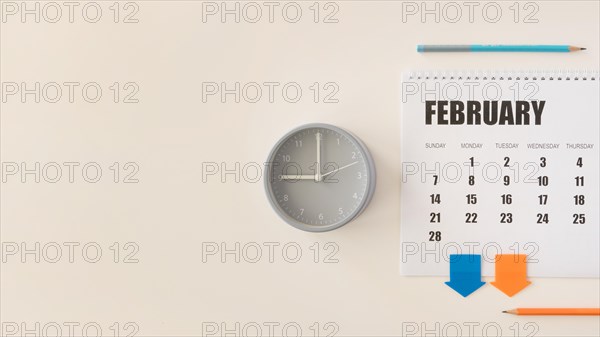 Top view desk february calendar clock