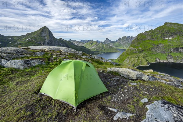 Green tent in the mountains
