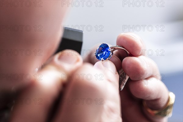 Checking a ring with a gemstone for authenticity