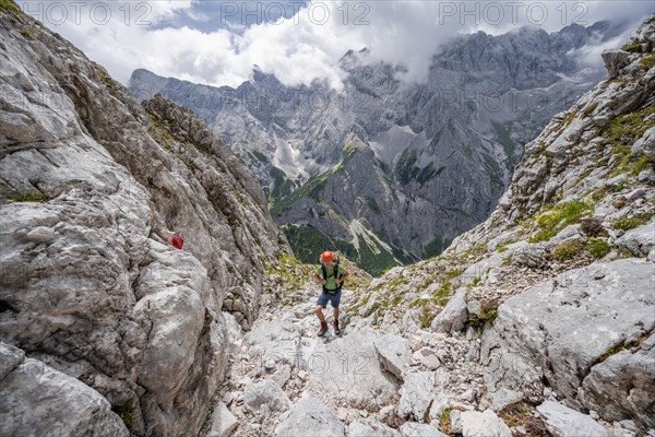 Mountaineer in steep rocky terrain on the way to Waxenstein