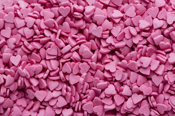 Top view heart shaped pink sweets