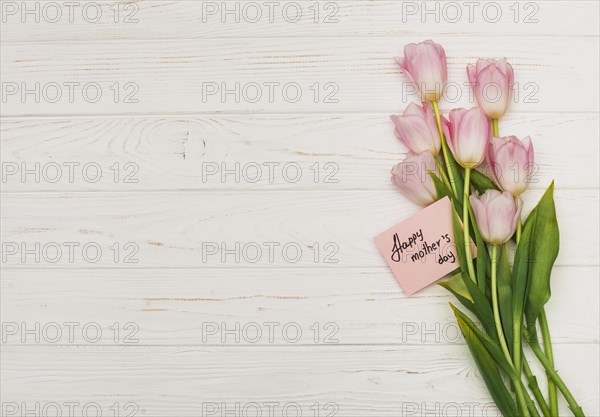 Flowers with happy mothers day card table