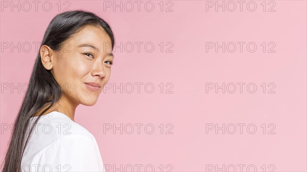 Sideways woman smirking camera