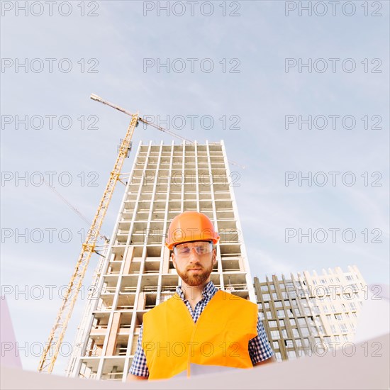 Bearded man studying draft