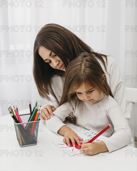 Mother spending time with her daughter home