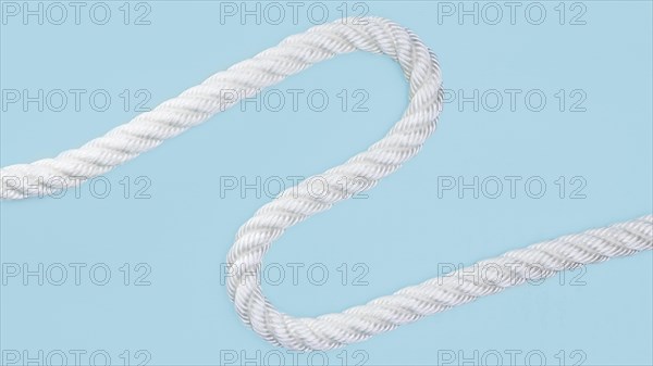 Wavy solid white rope blue background