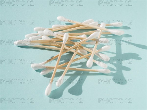 Arrangement with cotton buds blue background