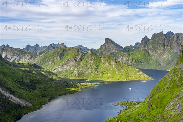 Mountain landscape with pointed mountain peaks and fjord Forsfjorden with village Vindstad