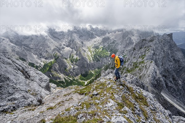 Mountaineer at the summit of the Waxenstein