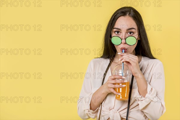 Woman green sunglasses with juice