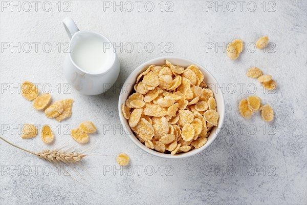 Top view corn flakes breakfast with milk wheat