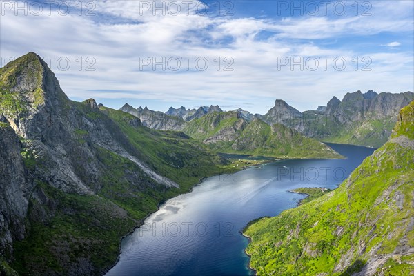 Mountain landscape with pointed mountain peaks and fjord Forsfjorden with village Vindstad