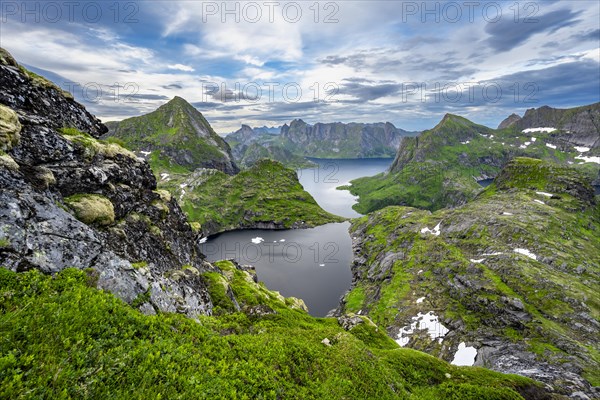 View over mountain landscape and lake Litlforsvatnet with fjord Forsfjorden