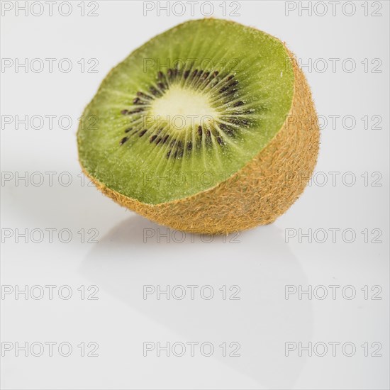 Close up fresh kiwi fruits white surface