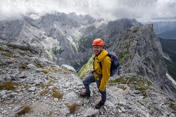 Mountaineer at the summit of the Waxenstein