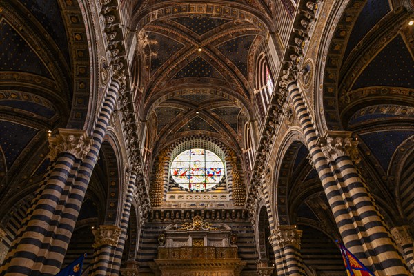 The nave of the cathedral with its black and white striped marble columns