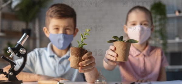 Medium shot kids holding plant pots