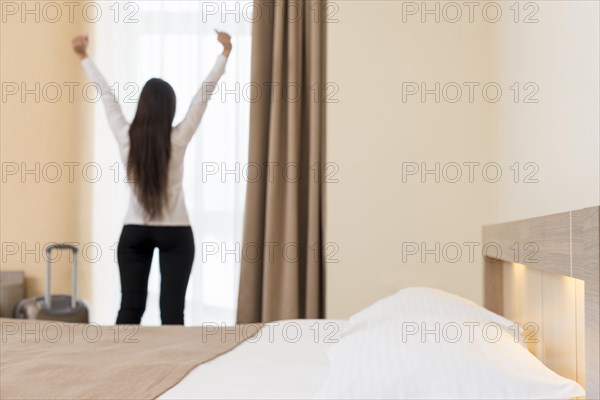 Woman relaxing hotel room