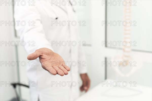 Male doctor offering his hand