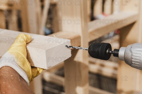 Close up person holding hammer drill