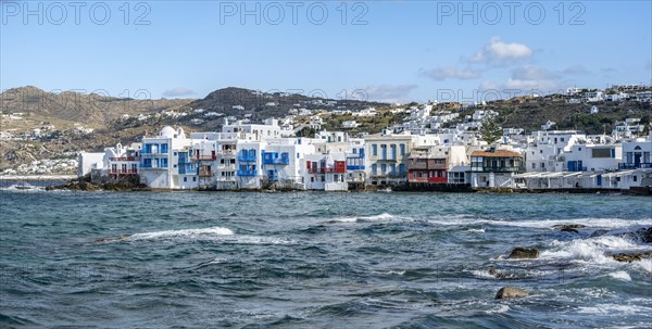 White Cycladic houses on the shore