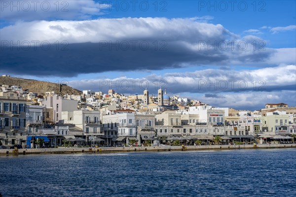 View of the town of Ermoupoli with pastel-coloured houses and the church of St Nicholas