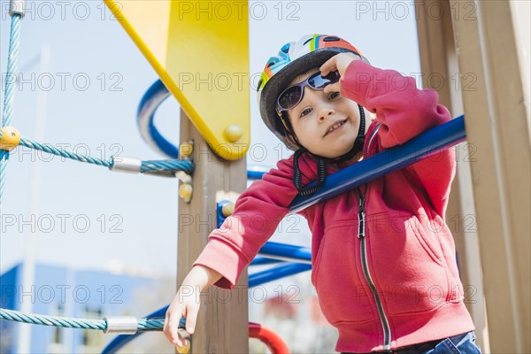 Kid playing outside playground