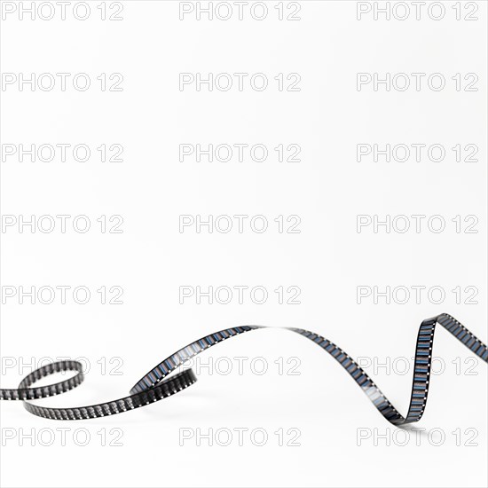 Curled film stripes isolated white background