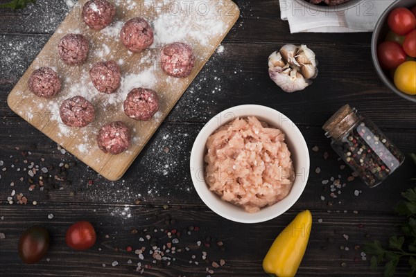 Flat lay meatballs wooden board minced meat