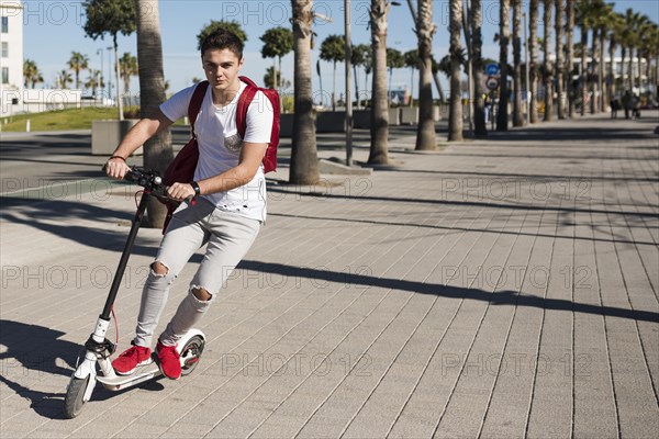 Teenage boy with scooter