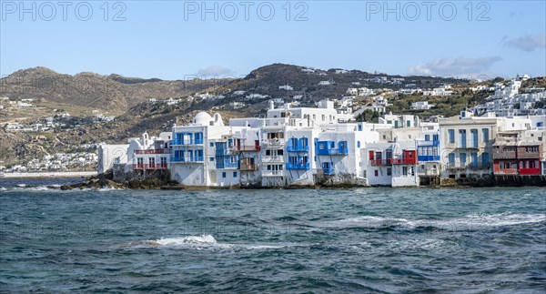 White Cycladic houses on the shore