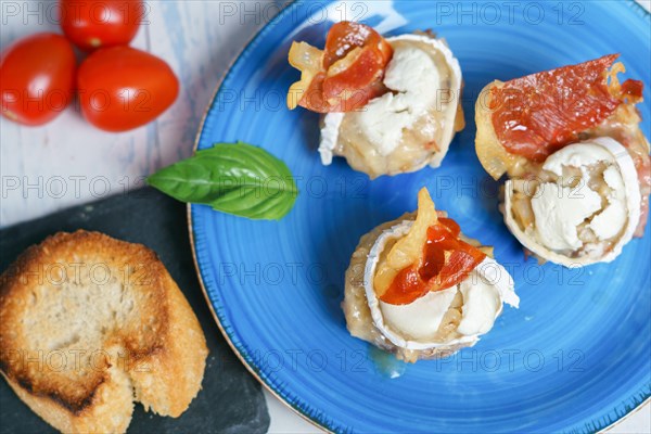 Mushrooms stuffed with goat cheese and iberian cured ham typical spanish tapa