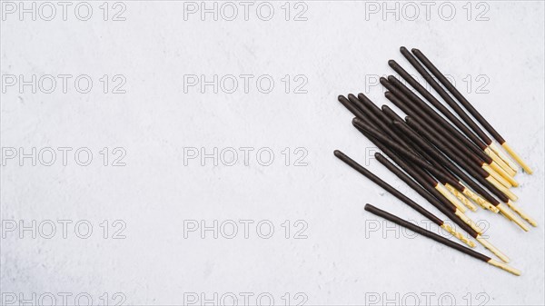 Biscuit sticks chocolate white backdrop
