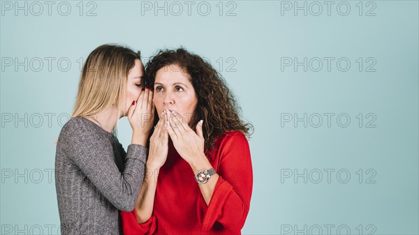 Daughter telling secret mother