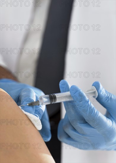 Patient being vaccinated by doctor