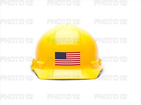 Yellow hardhat with an american flag decal on the front isolated on white background