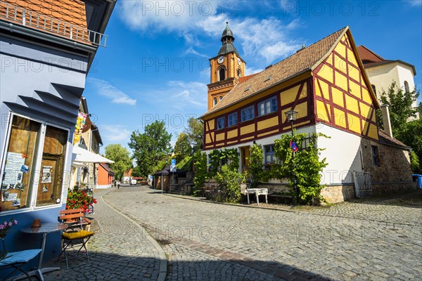 Half-timbered house in front of Buckow parish church