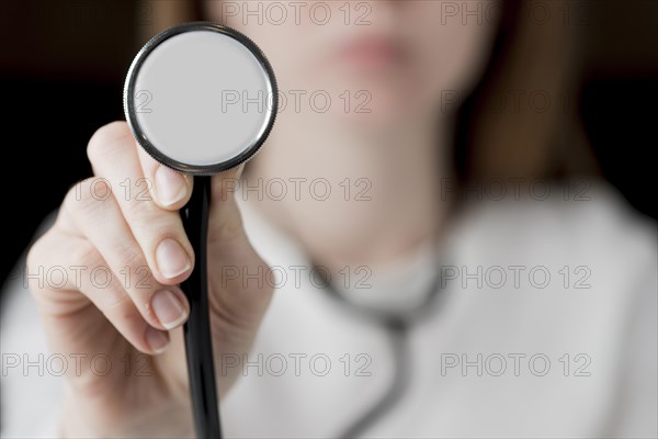 Doctor hearing with stethoscope