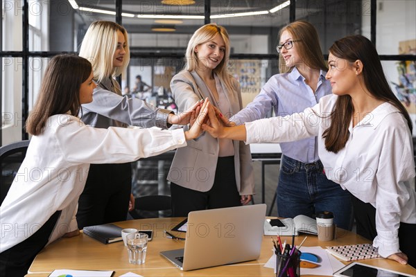 Women meeting celebrate business success