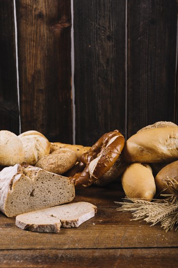 Freshly baked bread wooden textured background