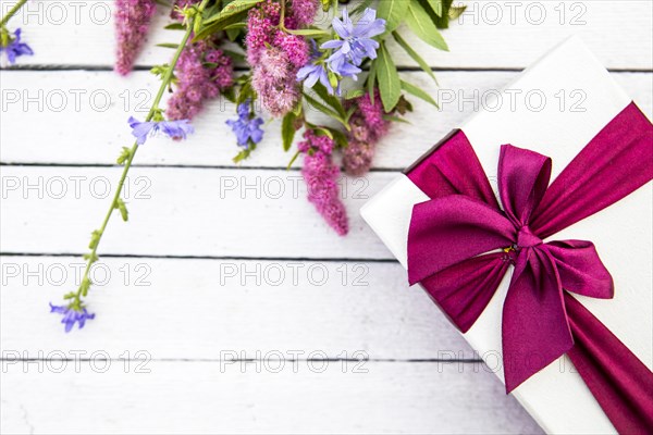 Flowers gift wooden background