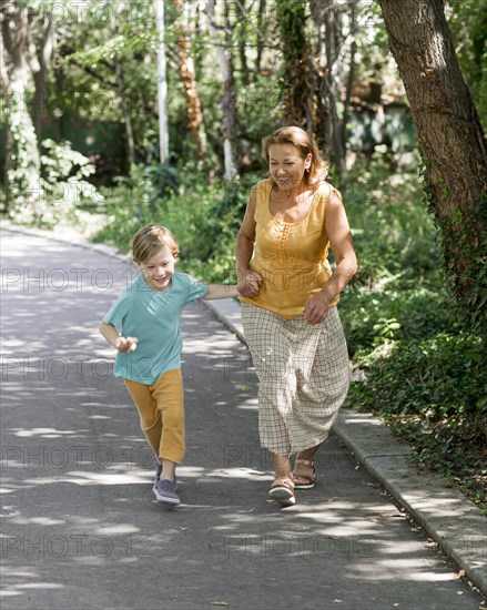 Full shot grandma kid running