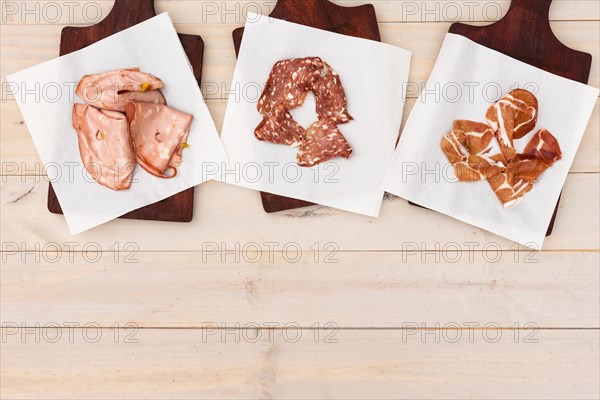 Different italian ham salami cutting board table