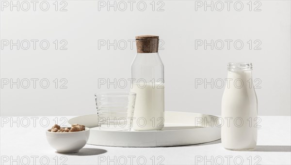 Front view milk bottle with walnuts tray