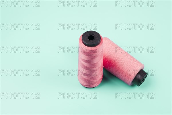 Pink spools mint background