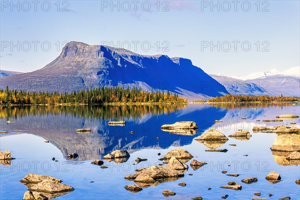 Mirrored lake in a beautiful mountainous landscape in beautiful autumn colours